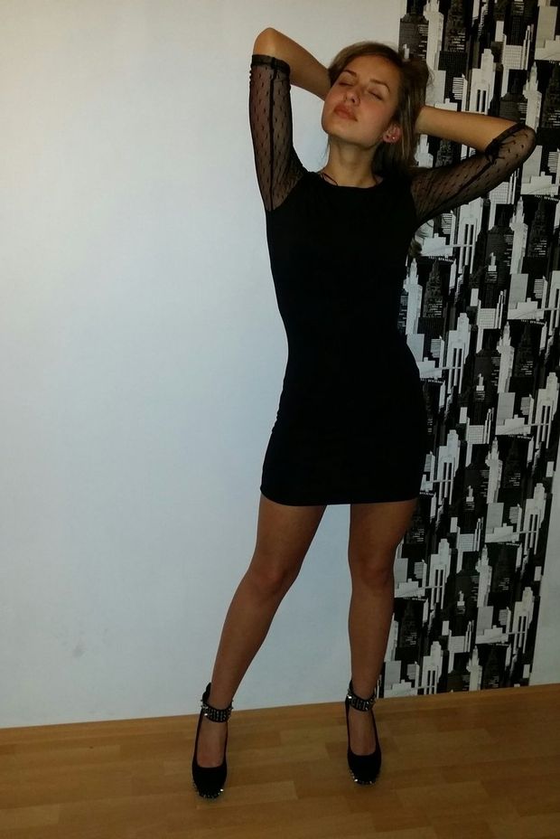 Pretty chick in nice black mini dress and heeled platforms