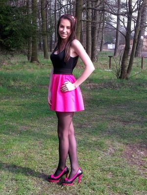 Nasty chick in pink posing outdoors