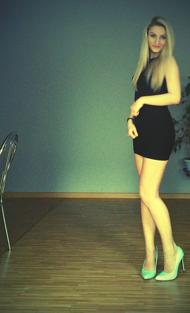 Leggy blonde babe in tight mini black dress