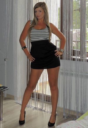 Nice leggy blonde in tight mni dress at home