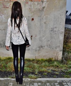 In tight black leggings