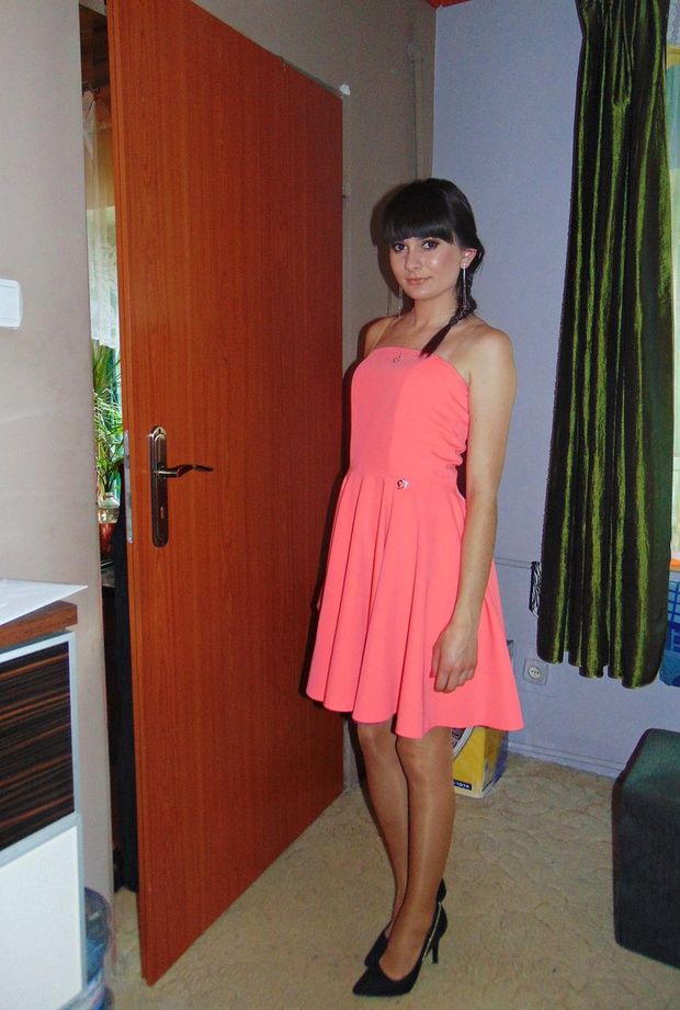 Brunette in pink dress and stilettos