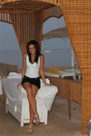Tanned leggy brunette at the beach