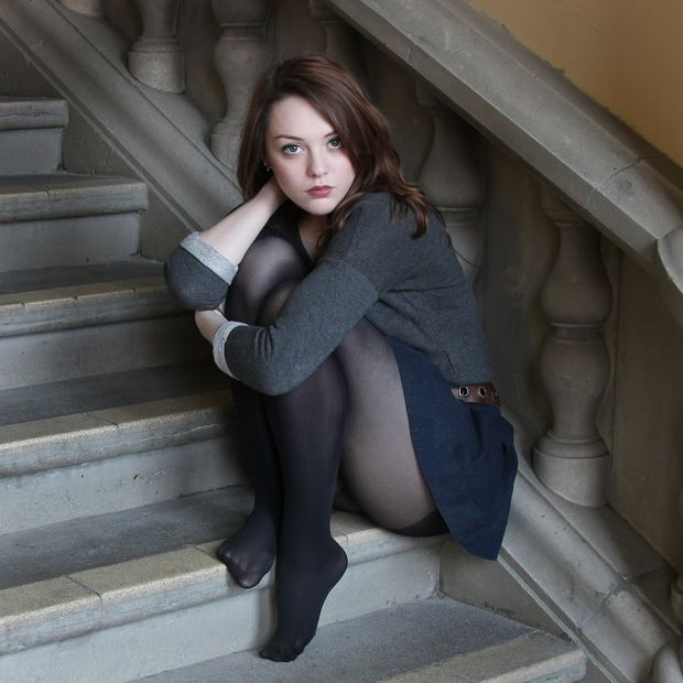 Moody clothed brunette
