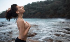 Sexy brunette topless in nature