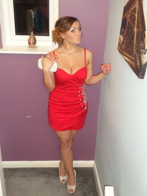 Busty blonde bimbo in tight mini red dress