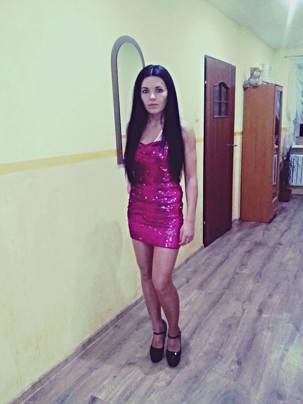 Leggy brunette babe in sexy mini dress with pink sequins