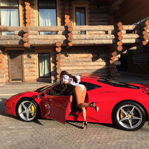 Rich babe in heels by her ferrari