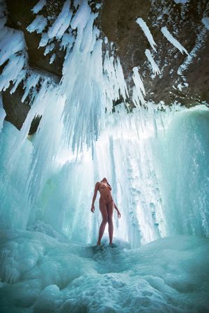 Naked in a frozen waterfall
