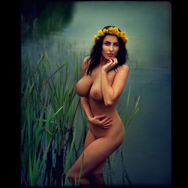 Busty brunette in water
