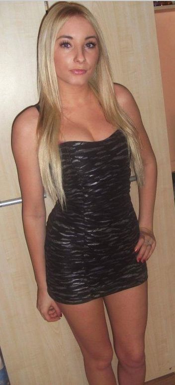 Cute busty bimbo in simple but sexy mini dress