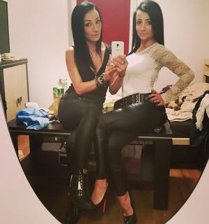 Bimbos in leggings posing for mirror shot