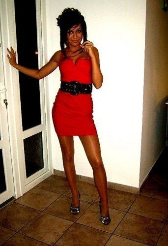 Tanned bimbo in tight red mini dress