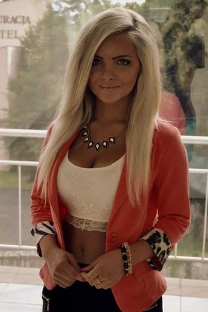 Sweet busty blonde chick in short tight lace top and pink jacket