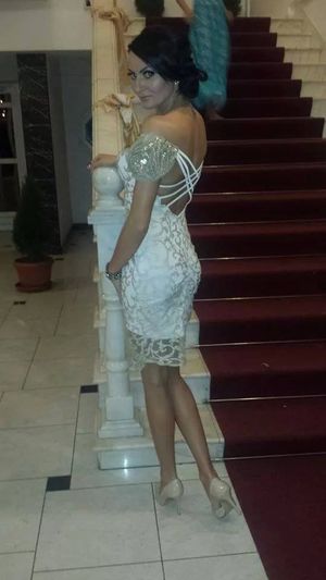 Nice dark hair chick posing in sexy white dress