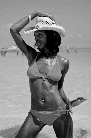 Fit black chick in the sea