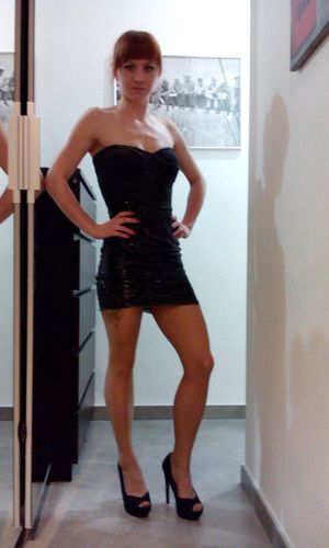 Smoking hot redhead beauty dressed to kill in really tight, mini dress and peeptoe high heeled platforms