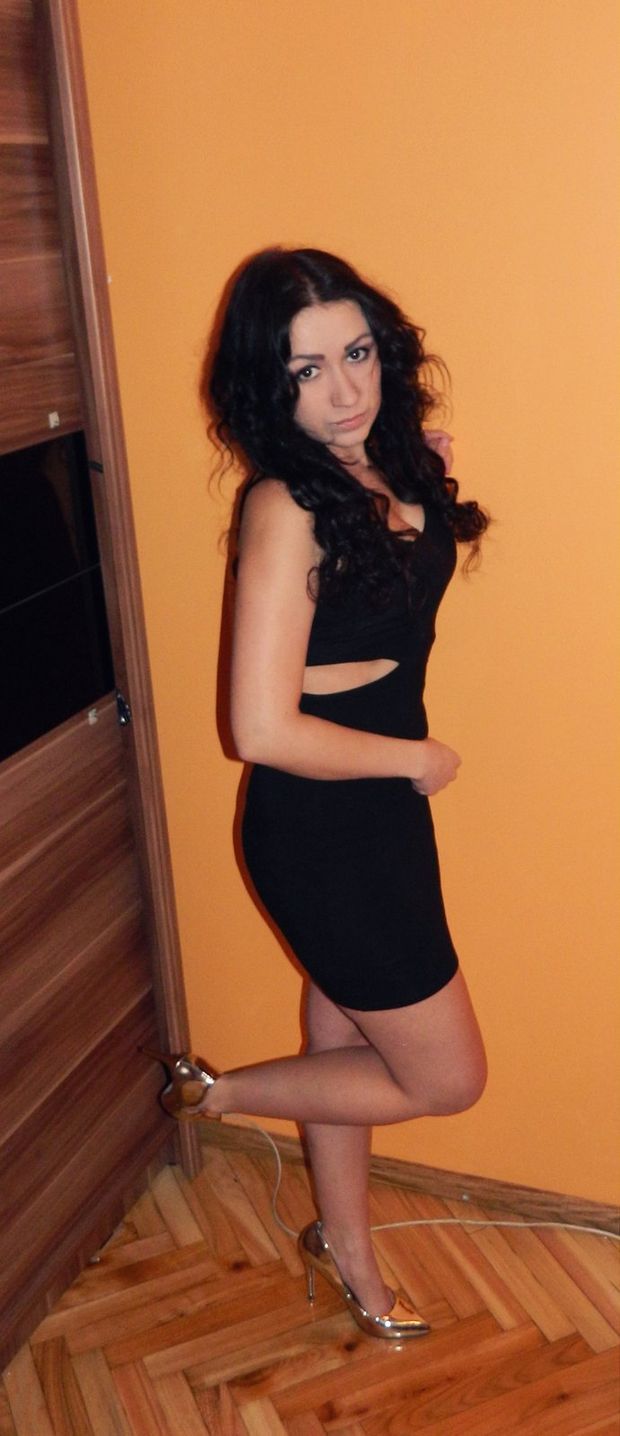 Really tight mini black dress and golden heels on some nice brunette