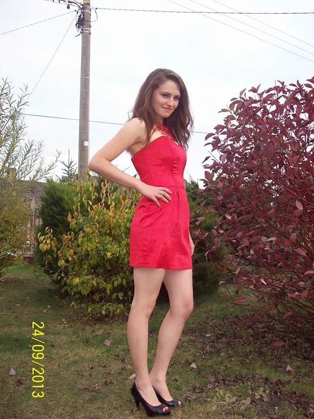Really hot brunette posing outdoors in sexy mini red dress and black peeptoe heels