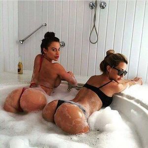2 hot women with nice asses in a bathtub nice and soapy