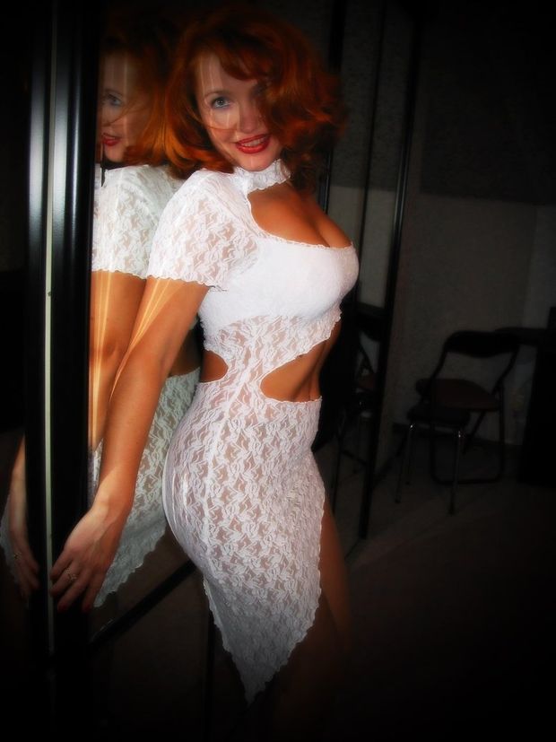 Redhead mature babe in sexy sheer white dress