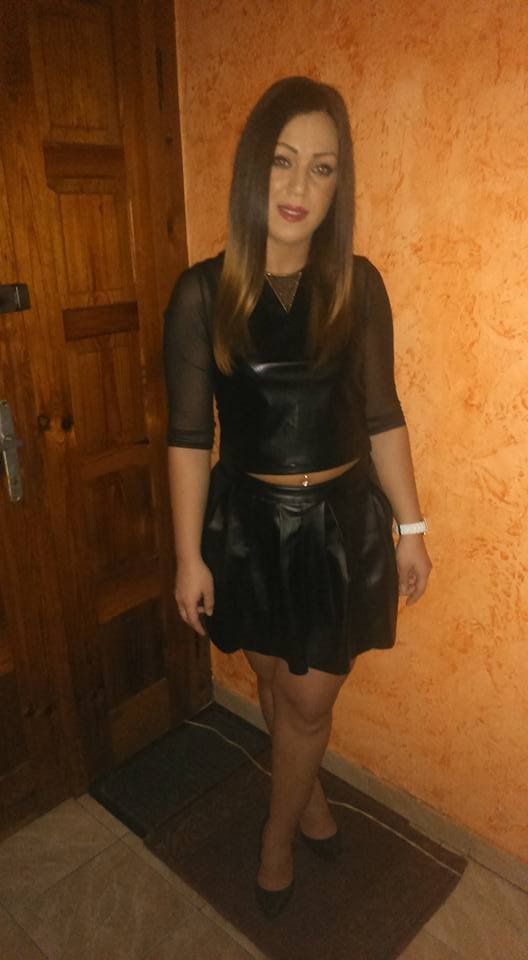 Brunette in leather skirt and top