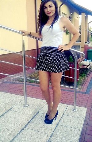 Cute babe in dotted mini skirt