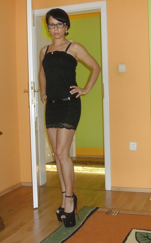 Leggy brunette babe in really high heels