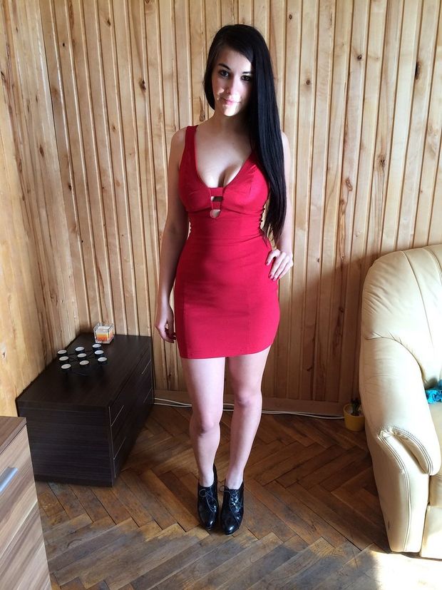 Nice busty and curvy brunette in tight mini red dress with sexy cleveage