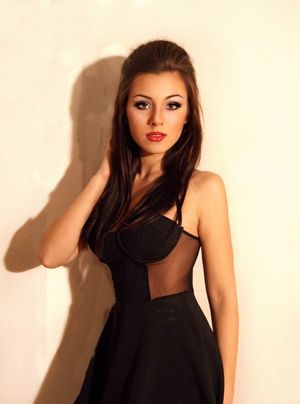 Sexy brunette in really nice dress with her shoulders exposed