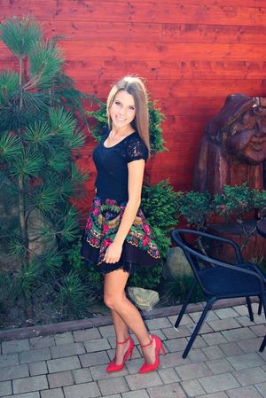 Nice dark hair blonde posing outdoors in sexy outfit