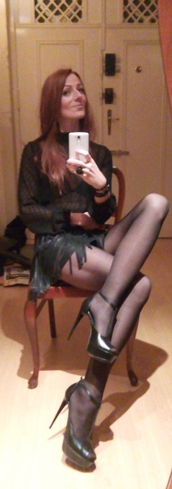 Delicious foxy mature babe exposing astonishing beautiful legs in nylons and high heels for selfie