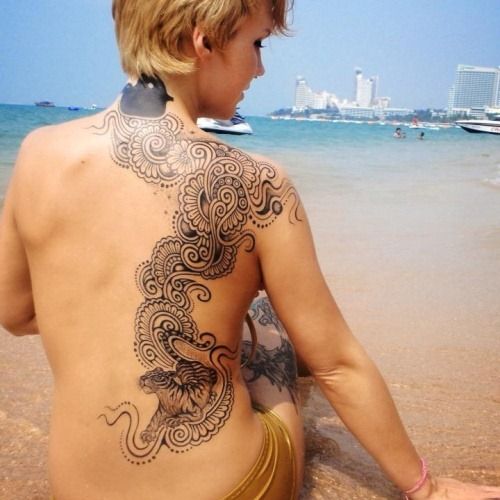 A truly beautiful tattoo. And she isn't too shabby either.
