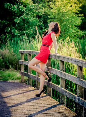 Red dress in green scenery