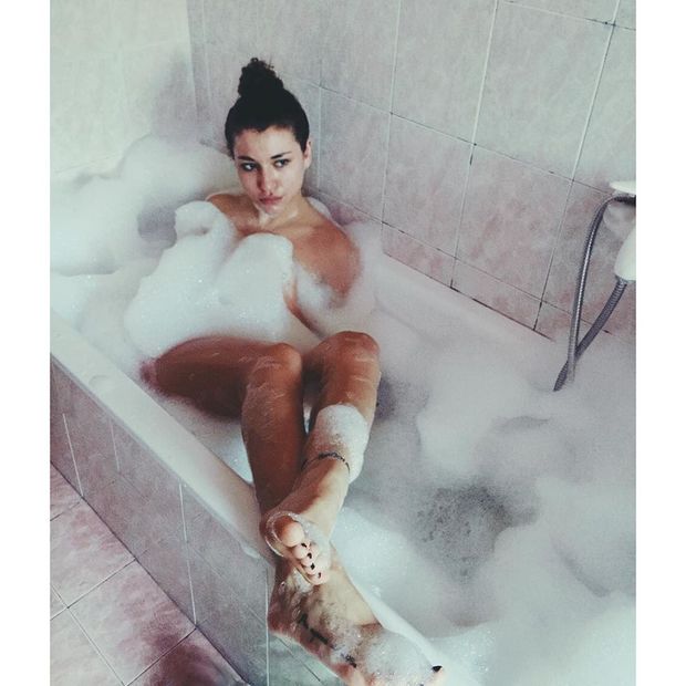Italian beauty taking a bath, showing her feet