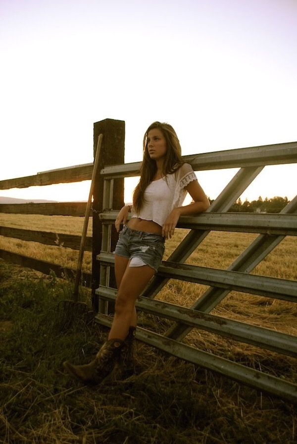 Country babe leaning on the gate