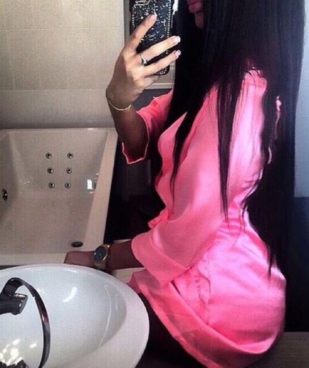 Hot black babe taking selfie wearing only a short pink robe