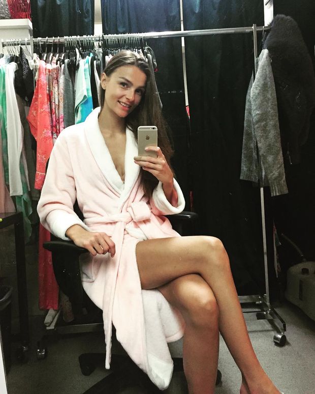Hot skinny brunette model in a pink bathrobe