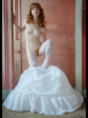 Redhead bride getting ready for wedding