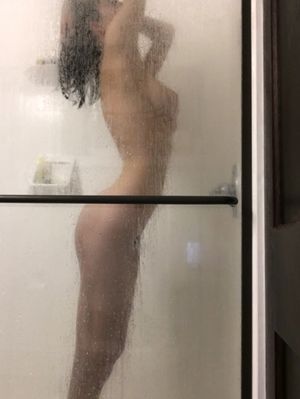 Cute little teen honey in the shower after sex with her boyfriend for the first time. She's still feeling the afterglow of orgasm.