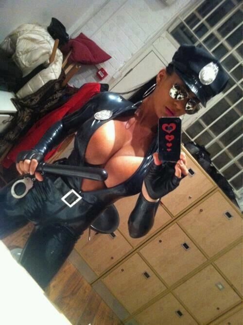 Hot brunette with big tits dressed as latex cop