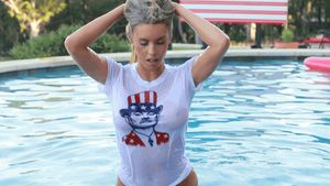 Blonde comming out of the pool in a wet white america patriotic t-shirt (An American wetdream come true)