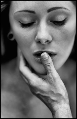 His fingers in her mouth