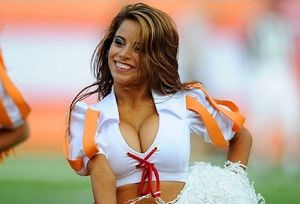 Sexy hot cheerleader is ALWAYS smiling because she knows all the guys are ogling her huge juggies that are packed so snuggly into her top.