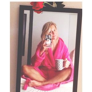 Sexy mom takes a selfie in nothing but a robe