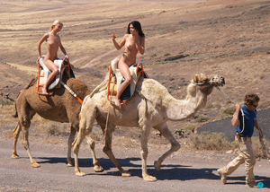 Riding camels naked on vacation.