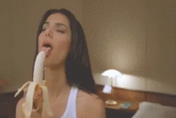 ..licking a banana..