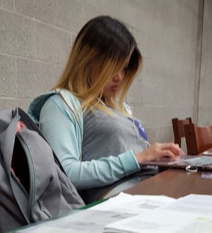 Beautiful Chinese College Student in Library
