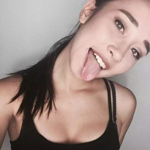 Cute teen sticking tongue out