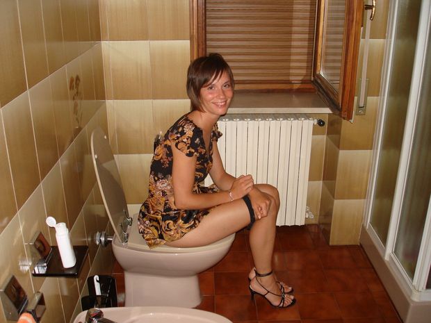 mature peeing on toilet